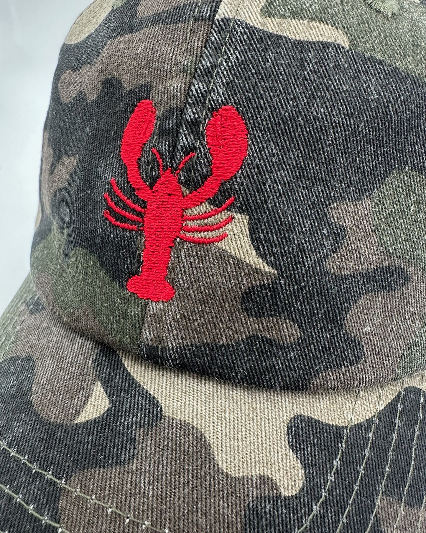 Vintage Cap mit hochwertiger Bestickung Lobster in camo von studio x monaco